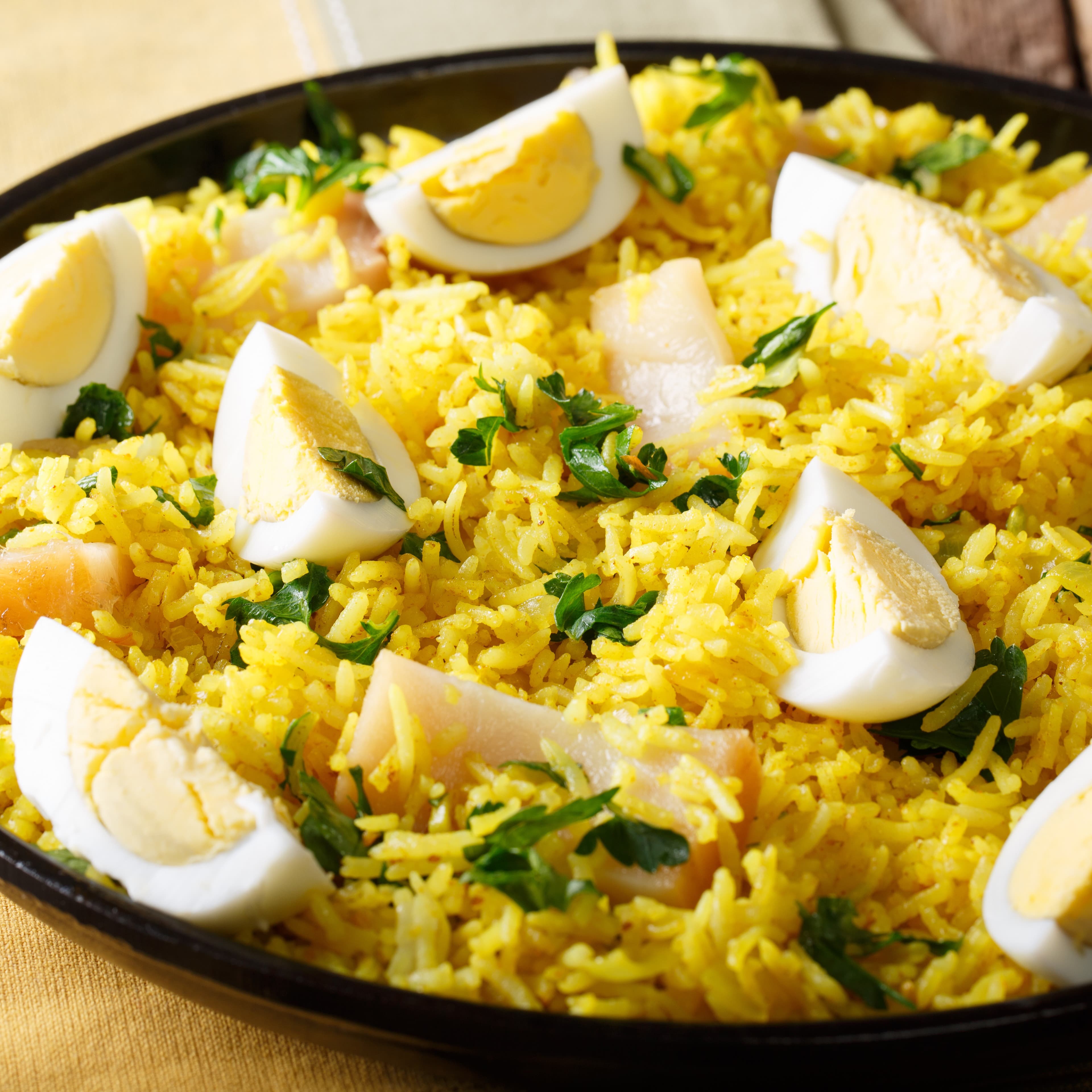 Kedgeree with smoked fish boiled eggs, topped with coriander leaf.